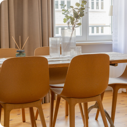 Dining room with orange chairs